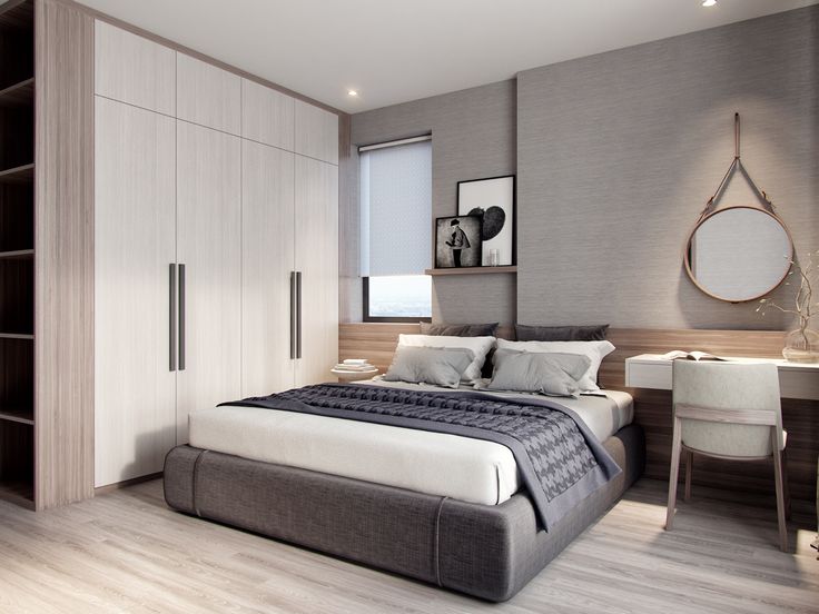 Thiết kế phòng ngủ tối giản cho người độc thân với giường bọc nệm, tủ cao kịch trần và bàn làm việc nhỏ gọn, tone màu xám trắng thanh lịch.